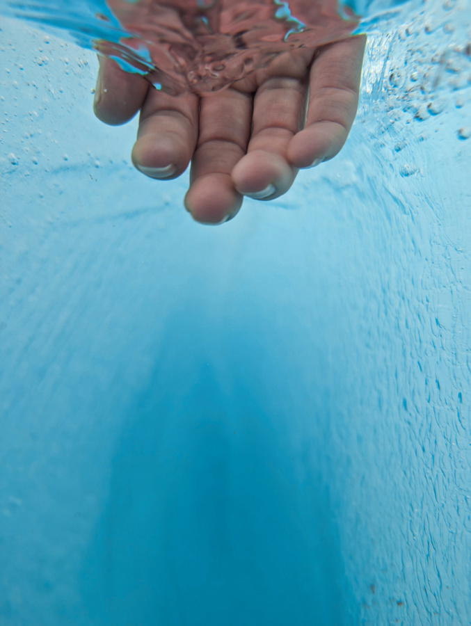 Hand dipping into glacial stream on Matanuska Glacier with Greatland Adventures Tour Glacier View Alaska 1