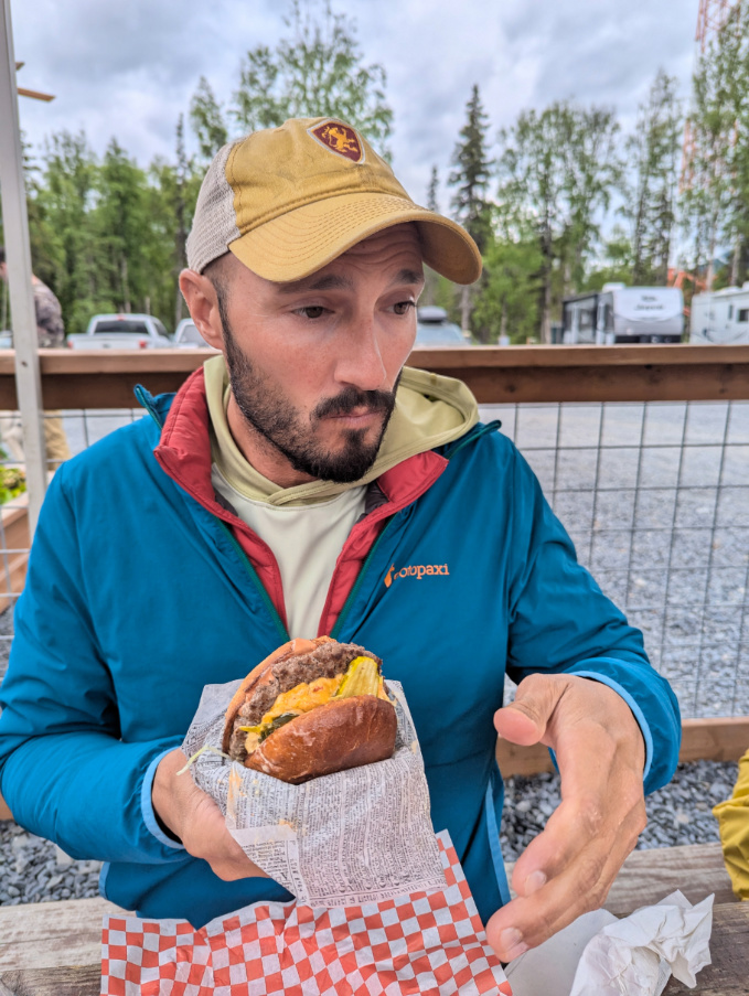 Rob Taylor eating burger at Cooper Landing Brewing Co Kenai Peninsula Alaska 1