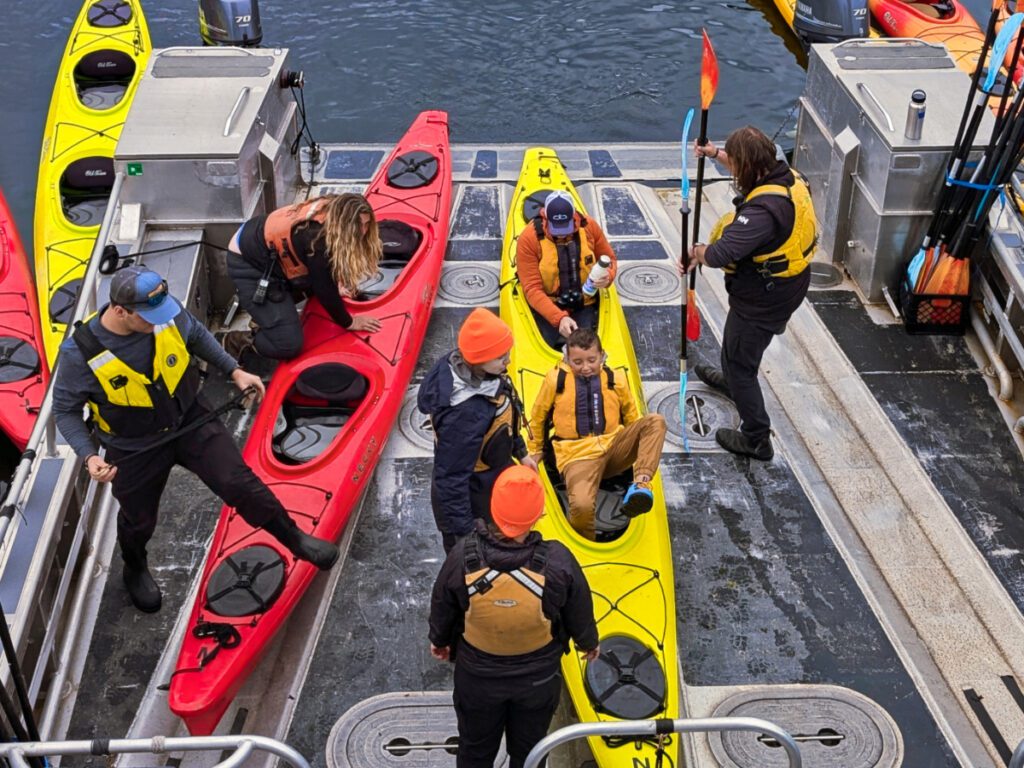 Taylor Family getting in Kayaks on Sea Dragon UnCruise Wilderness Legacy Alaska 1b