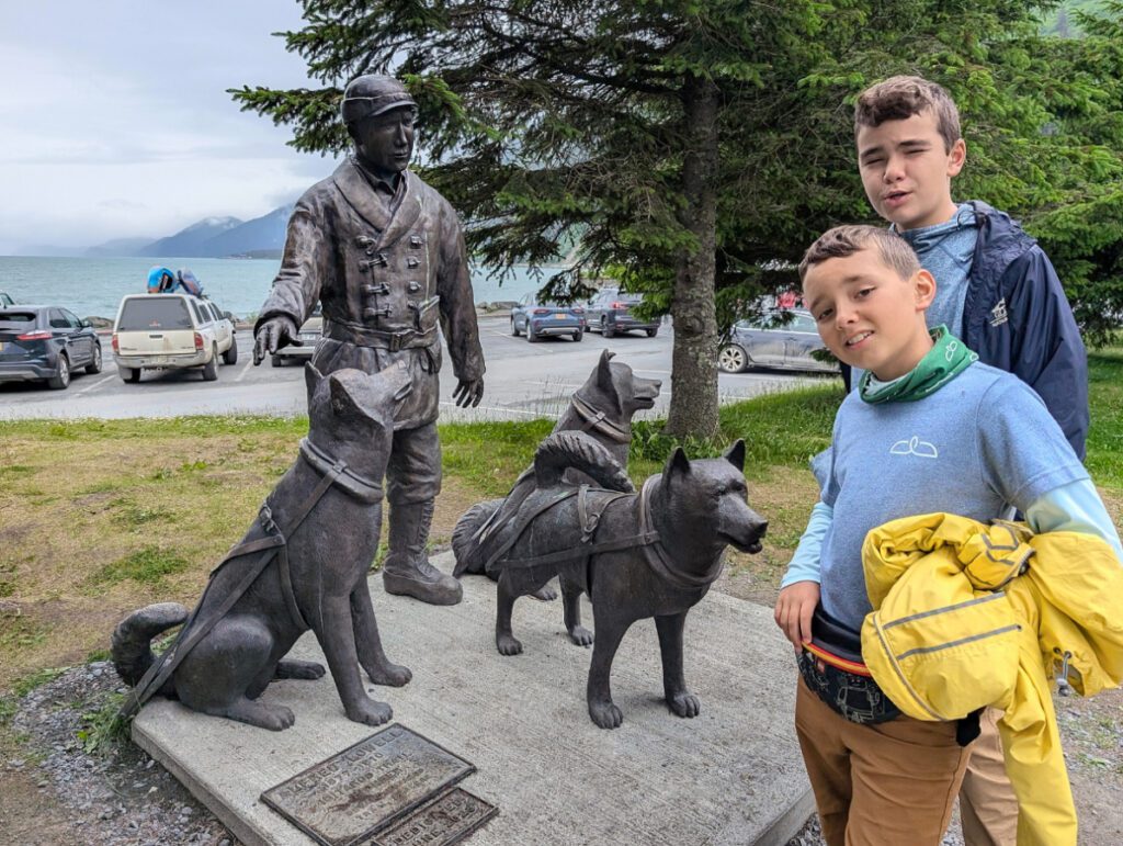 Taylor Family with Iditarod Statue at Mile 0 Seward Alaska 1