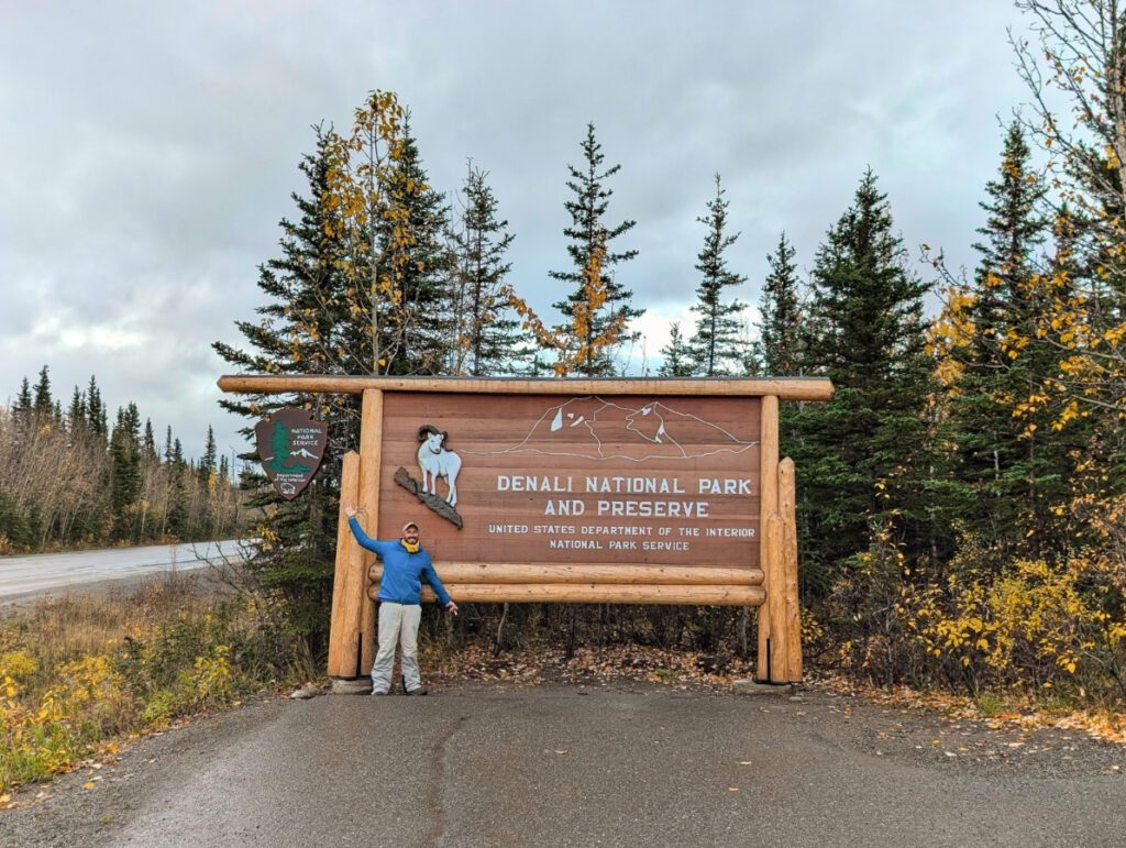 Rob Taylor at Entrance Sign at Denali National Park Alaska 4