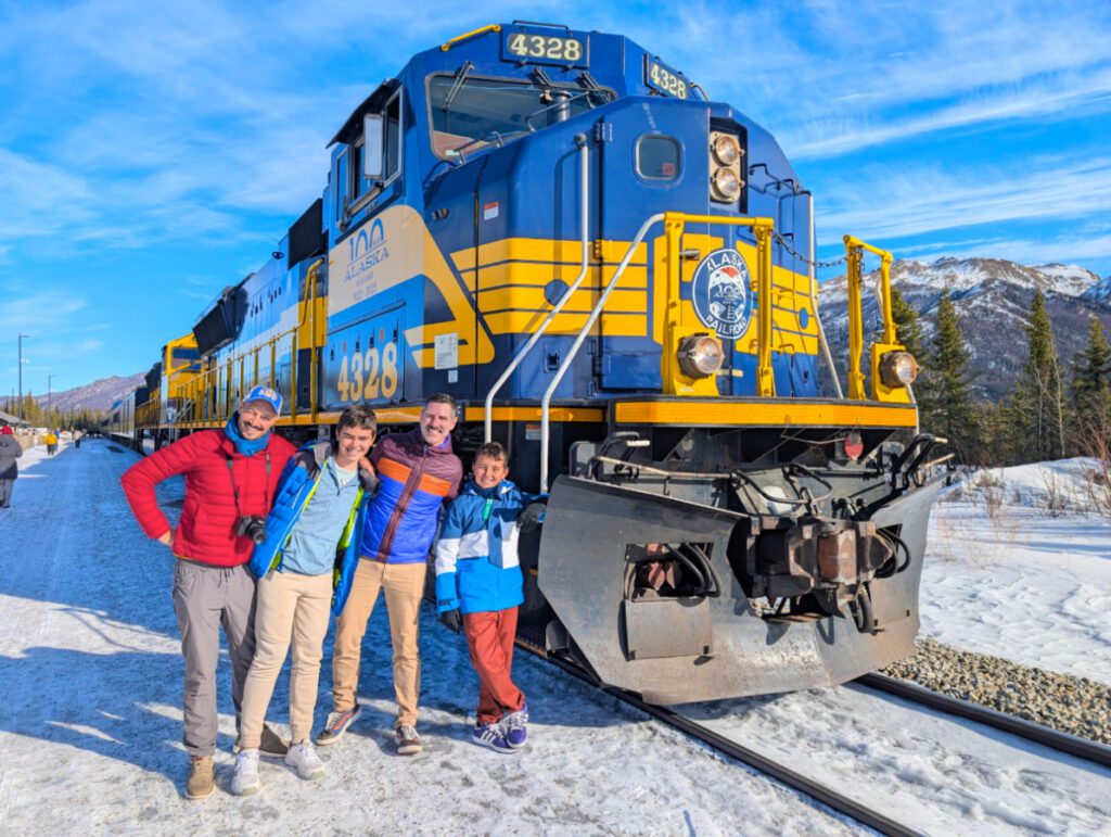 Full Taylor Family with Alaska Railroad Aurora Route Train in winter Talkeetna Alaska 1