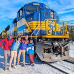 Full Taylor Family with Alaska Railroad Aurora Route Train in winter Talkeetna Alaska 1
