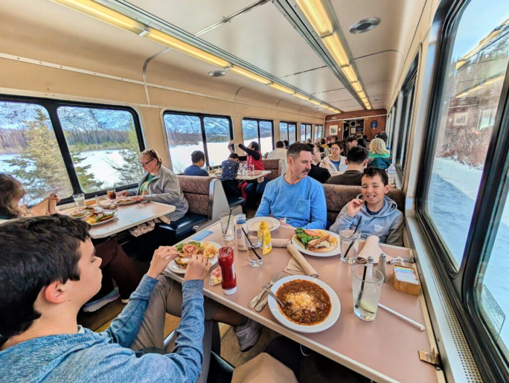 Taylor Family having lunch on Alaska Railroad Aurora Winter route from Fairbanks Alaska 3