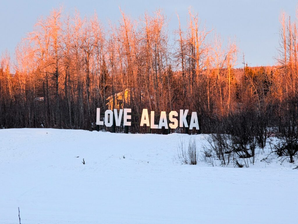 Love Alaska sign on Chena River from Pikes Waterfront Lodge Fairbanks Alaska 1