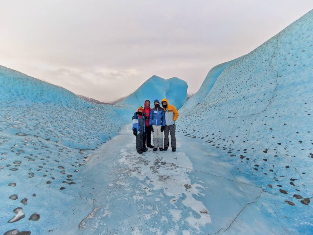 Full Taylor Family on Icebergs in Frozen Lake at Knik Glacier with Alaska Backcountry Adventures UTV Winter Tour Palmer Alaska 1