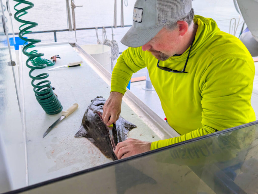 Ben Cleaning Fish caught on Mist Cove Boat Company Southeast Alaska 1
