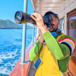 Rob Taylor with Camera on Mist Cove with the Boat Company Southeast Alaska 1b