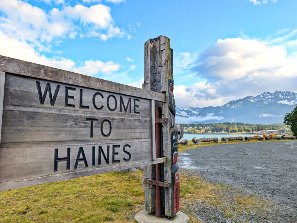 Welcome to Haines Sign with totem poles Haines Alaska 2
