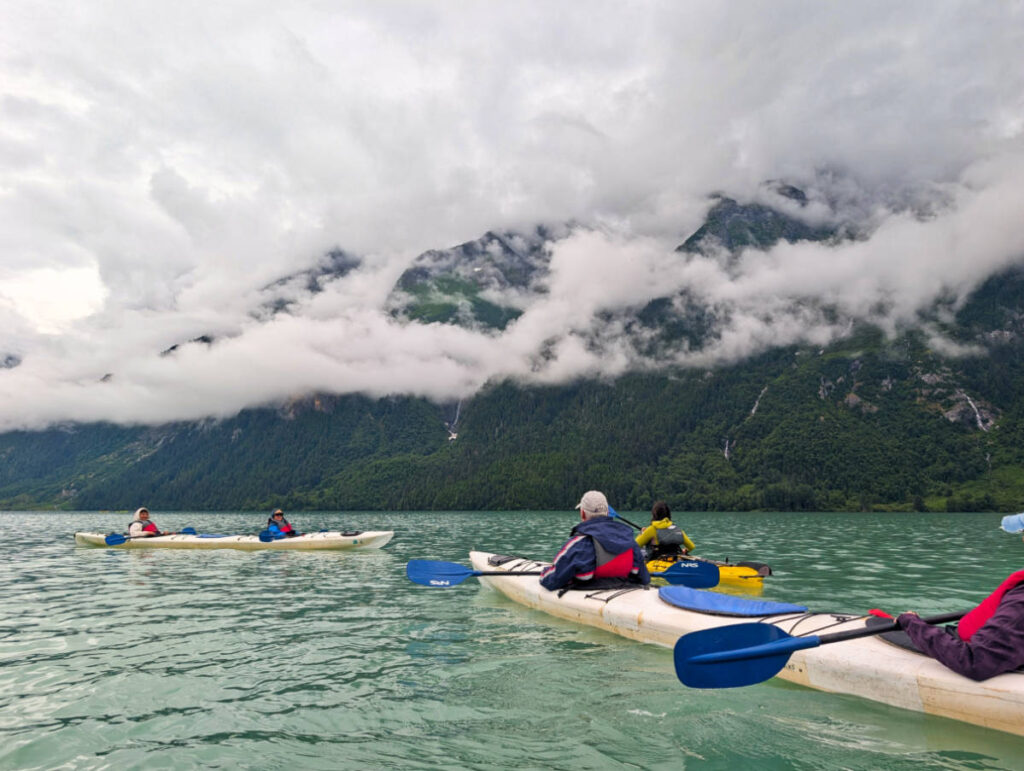 Misty Clouds on mountains at Chilkoot Lake State Park kayaking with Alaska Mountain Guides Haines Alaska