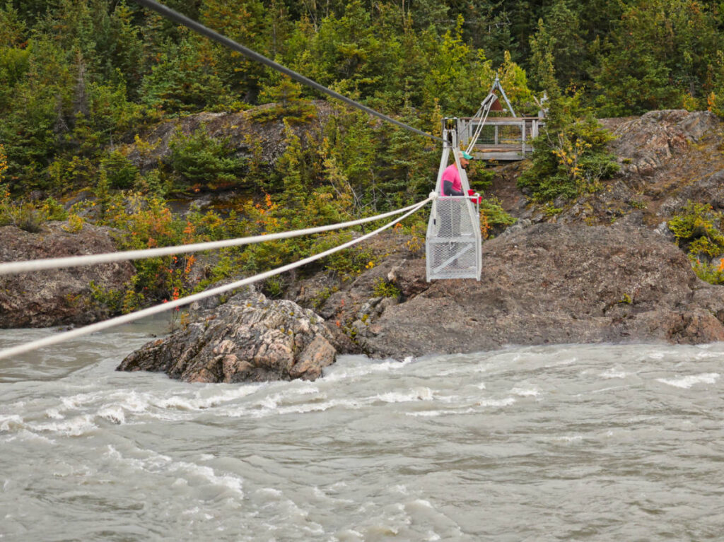 Rob Taylor in hand cart over Grewingk Glacier River in Kachemak Bay State Park Homer Alaska